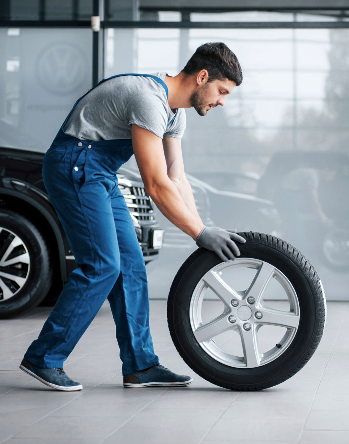 Man Moving Tire 1 Man Moving Tire 1